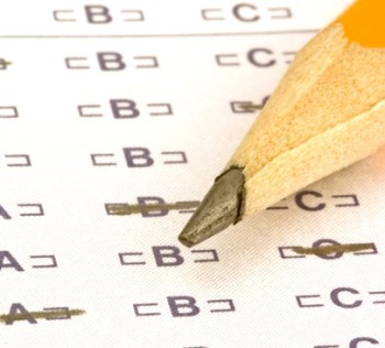 a pencil sitting on a test bubble sheet